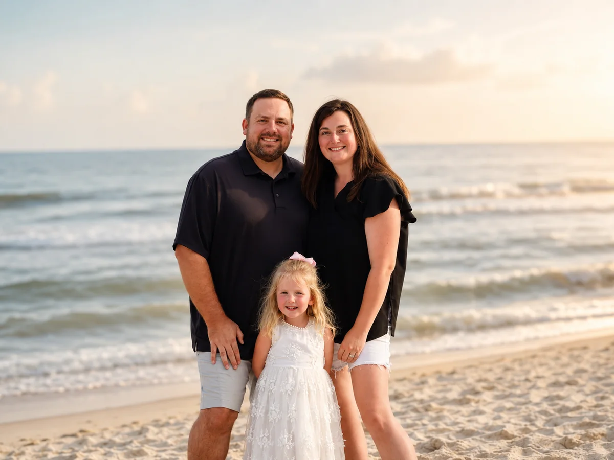 Dr. Kelsey Adcock with her husband and daughter at the beach